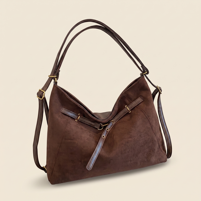 Bolso Multifuncional de Ante Vintage sobre fondo crema